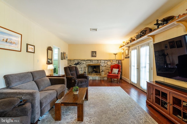 221 Shirley, Jeffersonville, PA 19403 - living area with dark wood-style flooring, plenty of natural light, and a stone fireplace