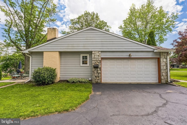 221 Shirley, Jeffersonville, PA 19403 - view of front of property with a chimney, driveway, a front lawn, stone siding, and a garage