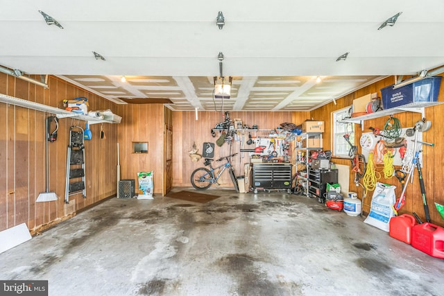 221 Shirley, Jeffersonville, PA 19403 - garage featuring wood walls, a workshop area, and a garage door opener