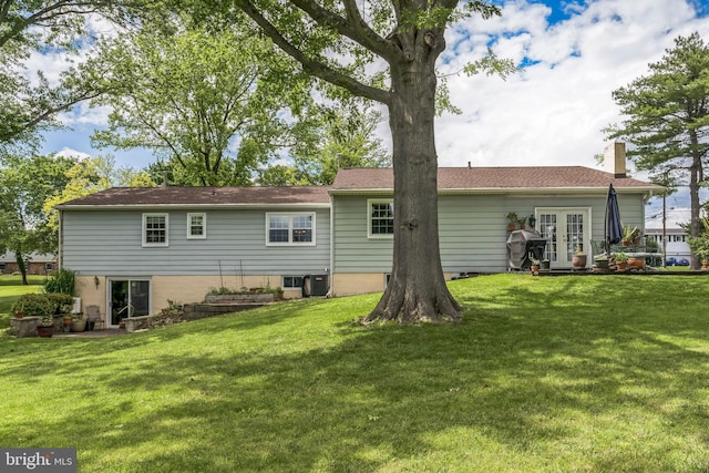 221 Shirley, Jeffersonville, PA 19403 - back of property with french doors, a chimney, and a lawn