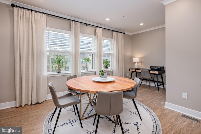 dining space with baseboards, light wood-style floors, crown molding, recessed lighting, and an office area