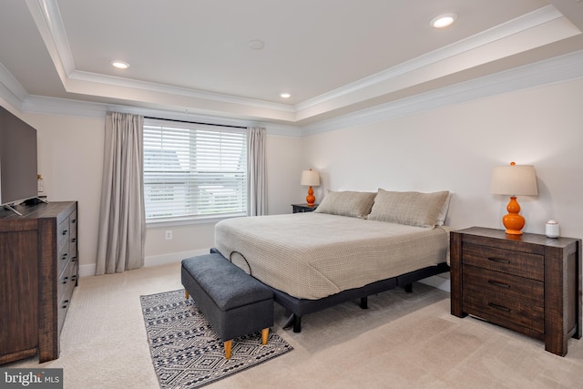 bedroom with a tray ceiling, light colored carpet, crown molding, baseboards, and recessed lighting