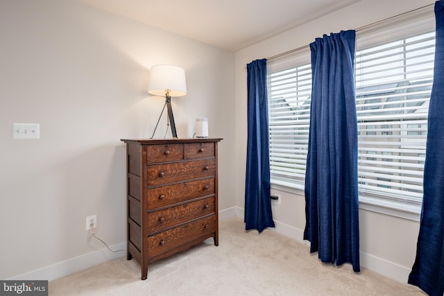 bedroom with carpet flooring and baseboards