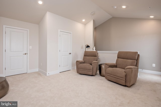 sitting room with carpet flooring, recessed lighting, baseboards, and vaulted ceiling