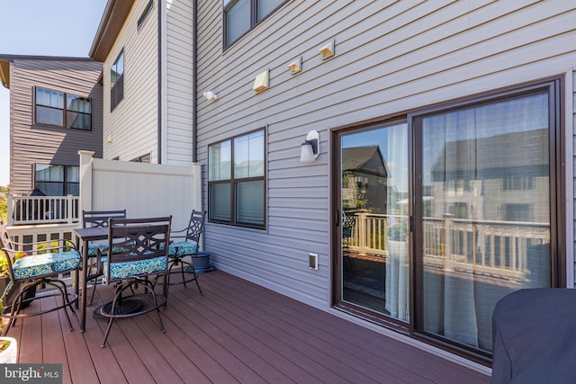deck with outdoor dining area