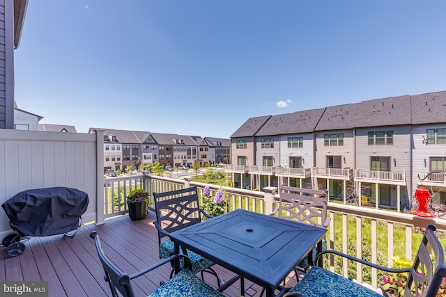 wooden deck featuring a residential view and area for grilling