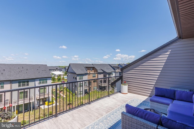 deck featuring outdoor lounge area and a residential view