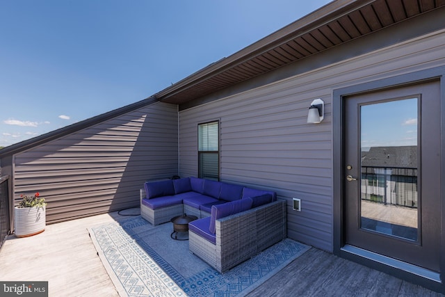 wooden deck featuring outdoor lounge area