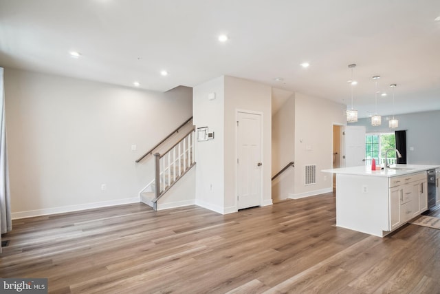1724 Atlas Dr, Frederick, MD 21702 - kitchen with a sink, recessed lighting, light wood-style flooring, light countertops, and dishwasher