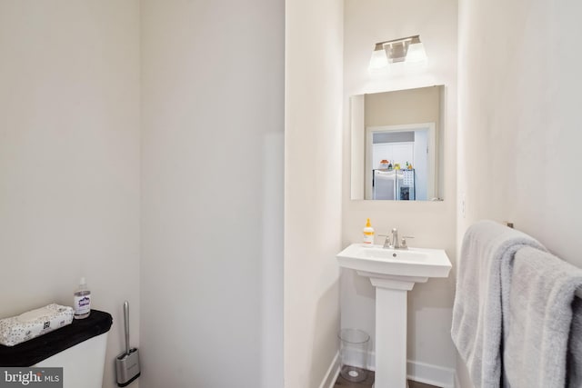 1724 Atlas Dr, Frederick, MD 21702 - half bath with a sink and baseboards