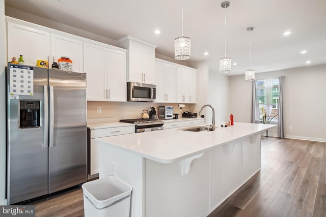 1724 Atlas Dr, Frederick, MD 21702 - kitchen with stainless steel appliances, a sink, recessed lighting, a kitchen island with sink, and white cabinetry