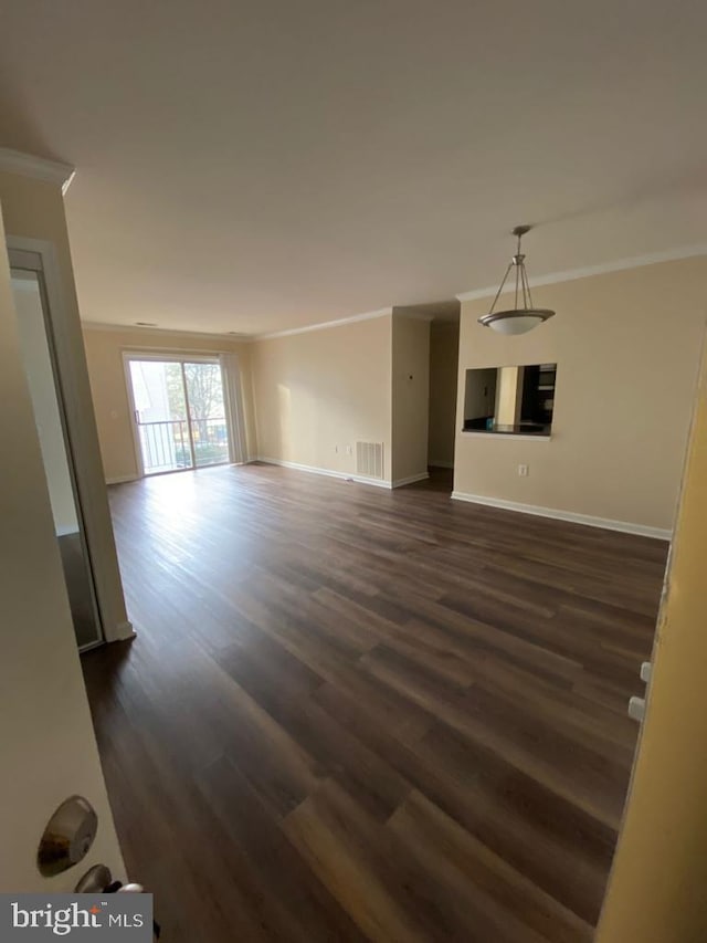 18318 Streamside Dr Unit 203, Gaithersburg, MD 20879 - unfurnished living room featuring crown molding, dark wood finished floors, and baseboards