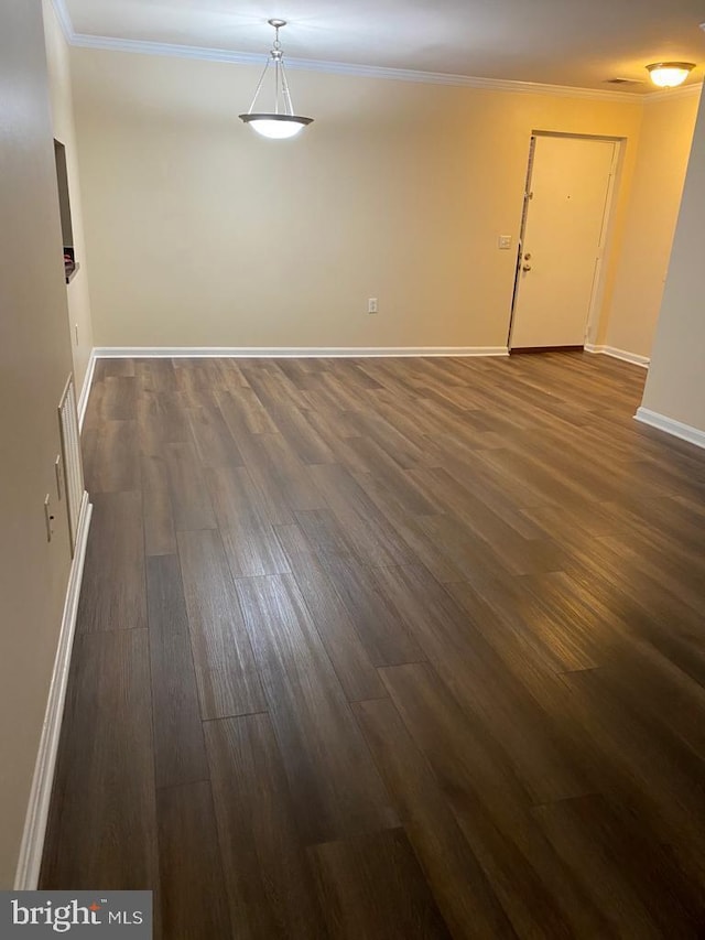 18318 Streamside Dr Unit 203, Gaithersburg, MD 20879 - empty room featuring crown molding, dark wood finished floors, and baseboards