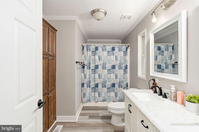 16155 Kerby Dr, Orange, VA 22960 - full bath featuring wood finished floors, double vanity, a textured ceiling, toilet, and ornamental molding