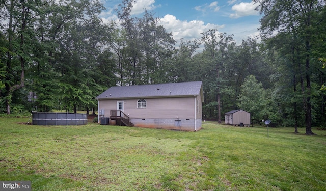 16155 Kerby Dr, Orange, VA 22960 - back of property with crawl space, an outdoor pool, a yard, and central air condition unit