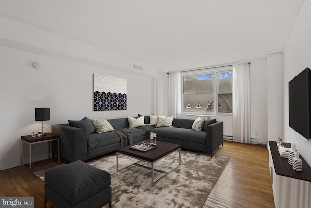 1101 Saint Paul St Unit 606, Baltimore, MD 21202 - living room featuring hardwood / wood-style floors and a baseboard heating unit