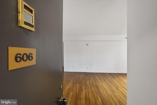 1101 Saint Paul St Unit 606, Baltimore, MD 21202 - corridor featuring hardwood / wood-style floors