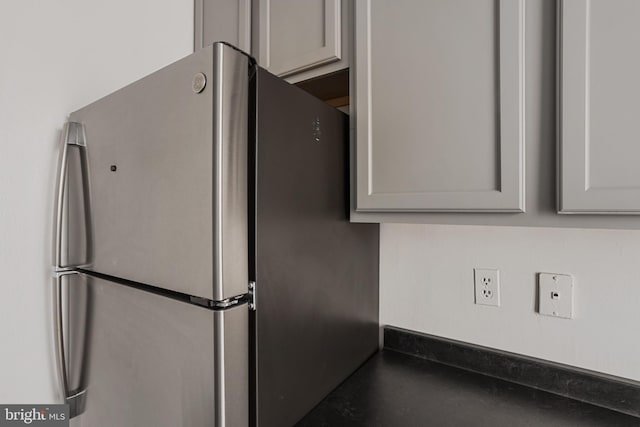 1101 Saint Paul St Unit 606, Baltimore, MD 21202 - kitchen with freestanding refrigerator, gray cabinets, and dark countertops