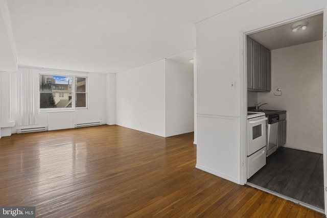1101 Saint Paul St Unit 606, Baltimore, MD 21202 - kitchen featuring a baseboard radiator, electric range, dark wood-style flooring, and a sink