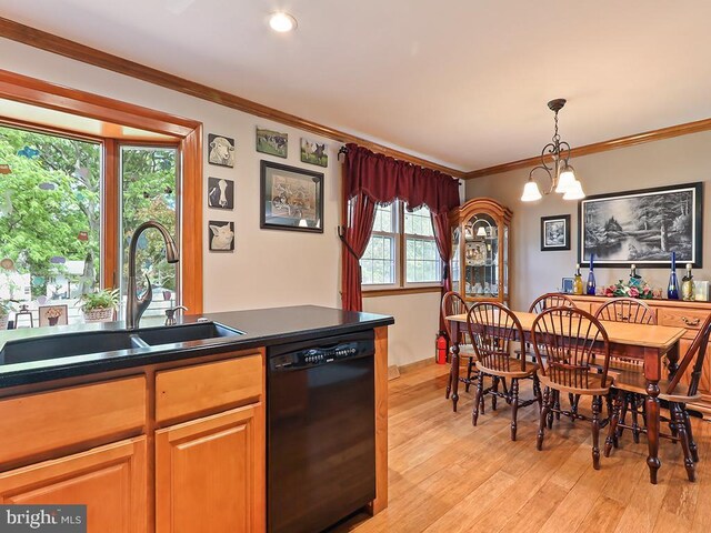 201 Hunter Ln, North Wales, PA 19454 - kitchen featuring black dishwasher, a sink, light wood-type flooring, dark countertops, and crown molding