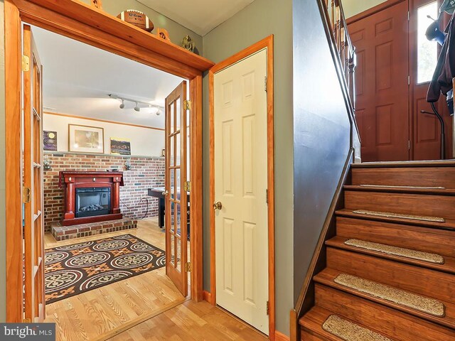 201 Hunter Ln, North Wales, PA 19454 - entrance foyer featuring stairway, wood finished floors, a fireplace, and baseboards