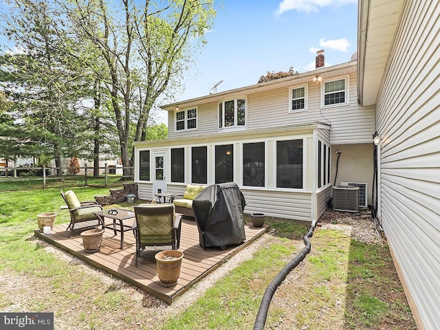 201 Hunter Ln, North Wales, PA 19454 - back of property featuring a sunroom, a deck, central AC, and a chimney
