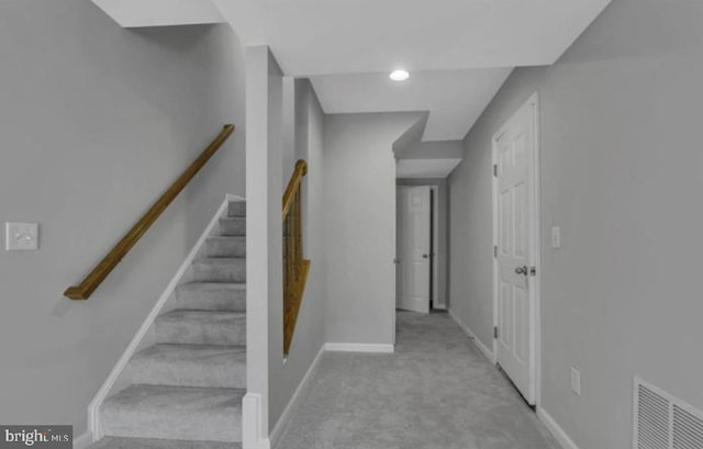 stairs featuring carpet floors, baseboards, and recessed lighting