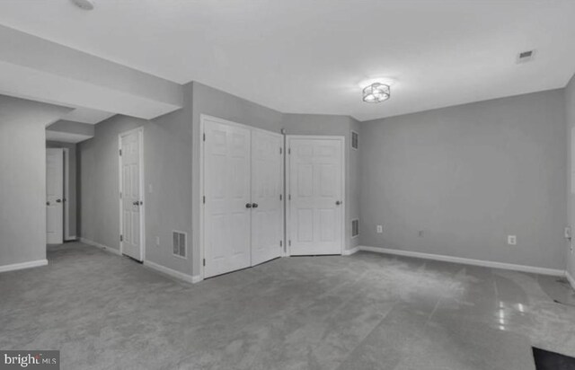 unfurnished bedroom featuring baseboards and carpet floors