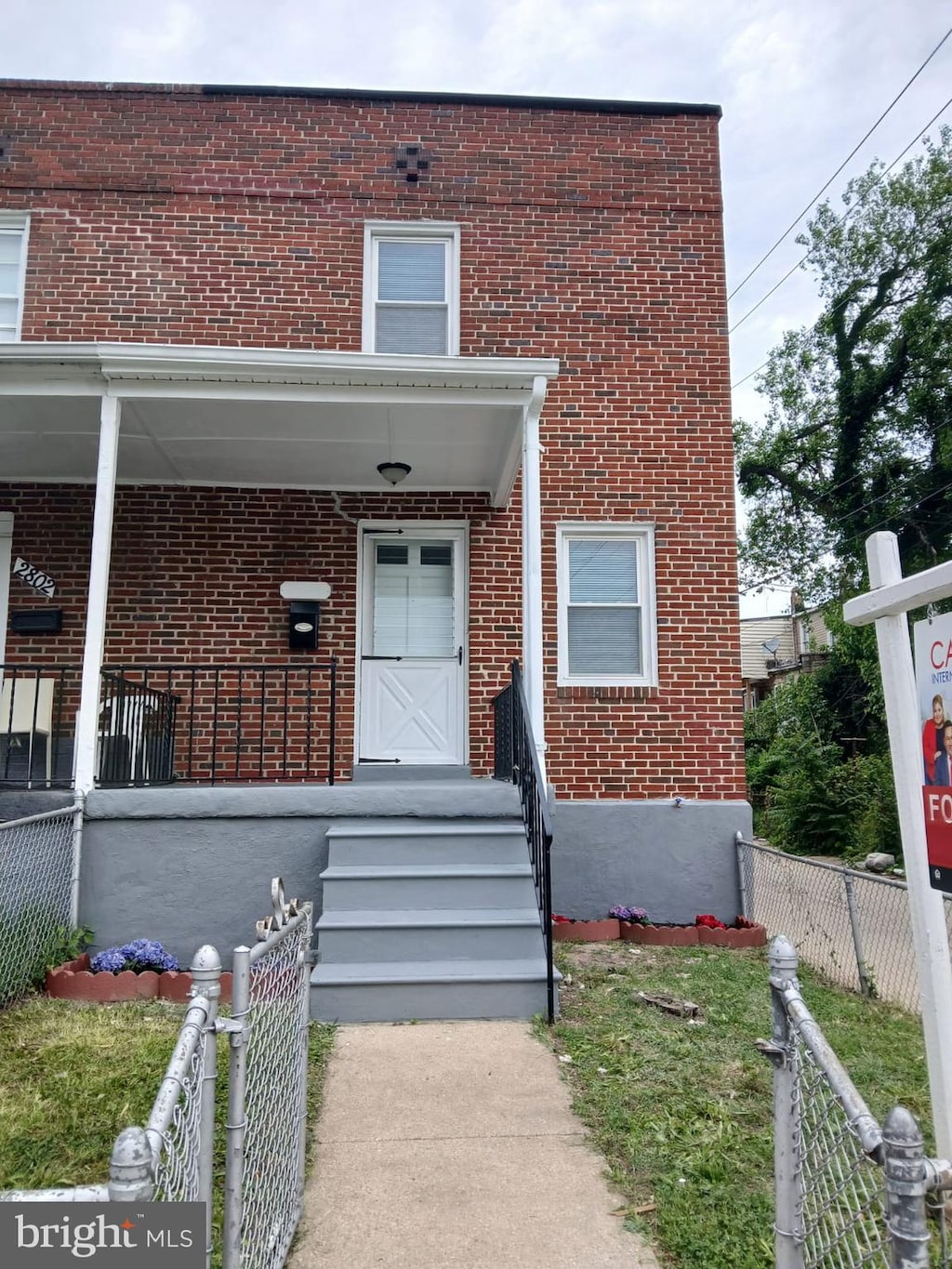 2800 Oswego Ave, Baltimore, MD 21215 - doorway to property featuring brick siding