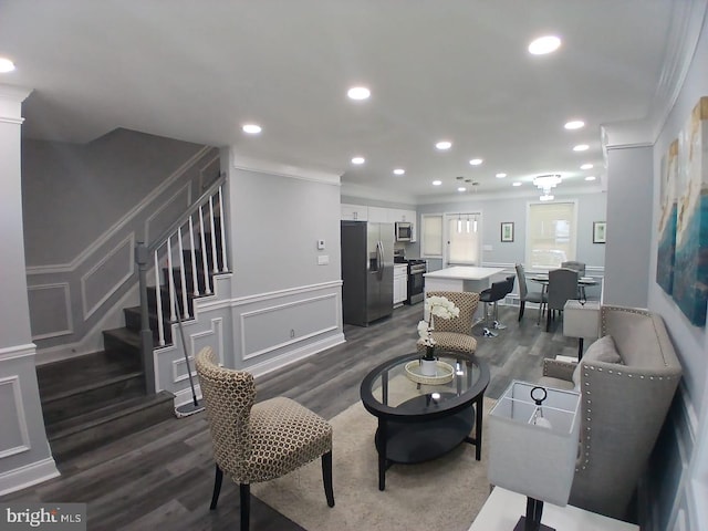 2800 Oswego Ave, Baltimore, MD 21215 - living room featuring crown molding, dark wood-style flooring, stairs, a decorative wall, and recessed lighting