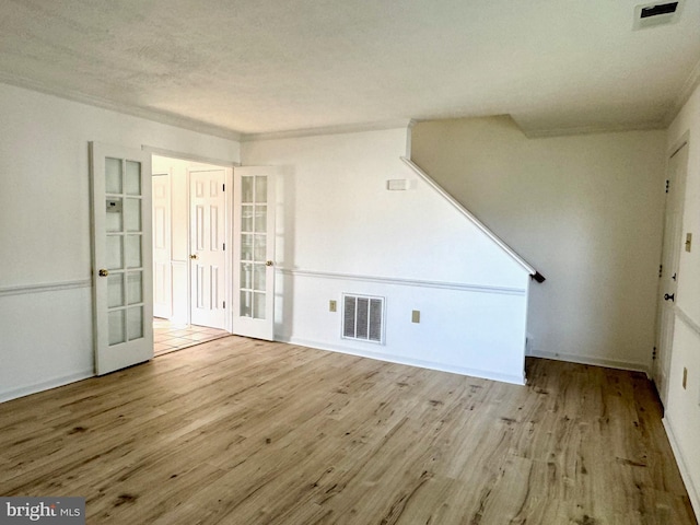 326 Banbury Ter, Winchester, VA 22601 - unfurnished living room featuring french doors, wood finished floors, and baseboards