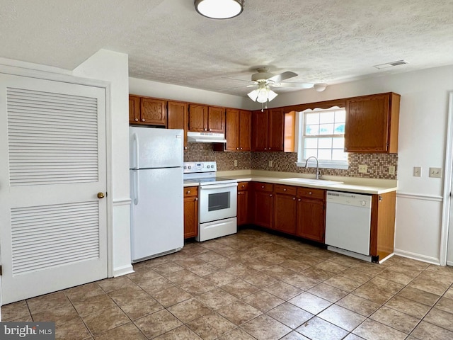 326 Banbury Ter, Winchester, VA 22601 - kitchen with white appliances, under cabinet range hood, a sink, backsplash, and a ceiling fan