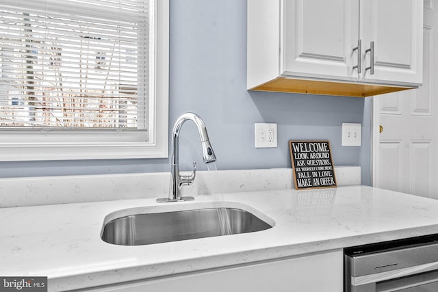 818 N Rose St, Baltimore, MD 21205 - kitchen view of a sink, white cabinets, and light stone countertops