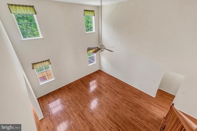 18776 Pier Trail Dr, Triangle, VA 22172 - empty room featuring a high ceiling, wood finished floors, and ceiling fan
