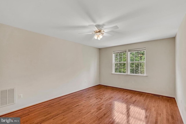 18776 Pier Trail Dr, Triangle, VA 22172 - empty room featuring wood finished floors, a ceiling fan, and baseboards
