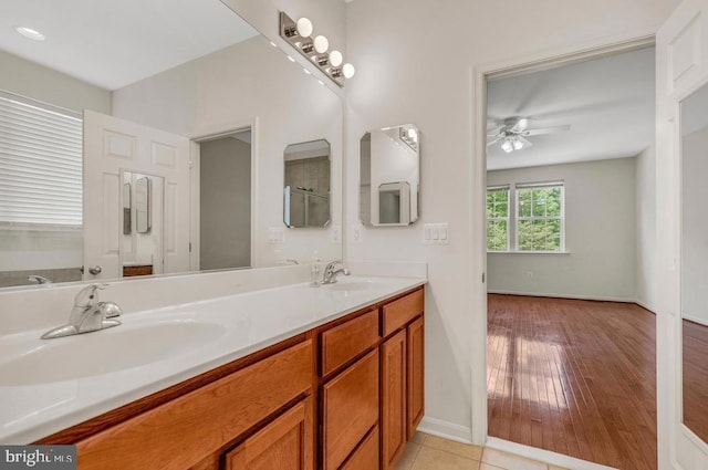 18776 Pier Trail Dr, Triangle, VA 22172 - full bath with double vanity, ceiling fan, and baseboards