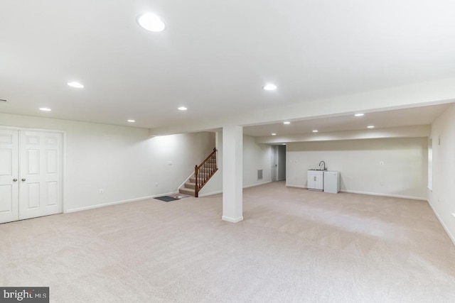 18776 Pier Trail Dr, Triangle, VA 22172 - finished below grade area with recessed lighting, stairs, light carpet, baseboards, and a sink
