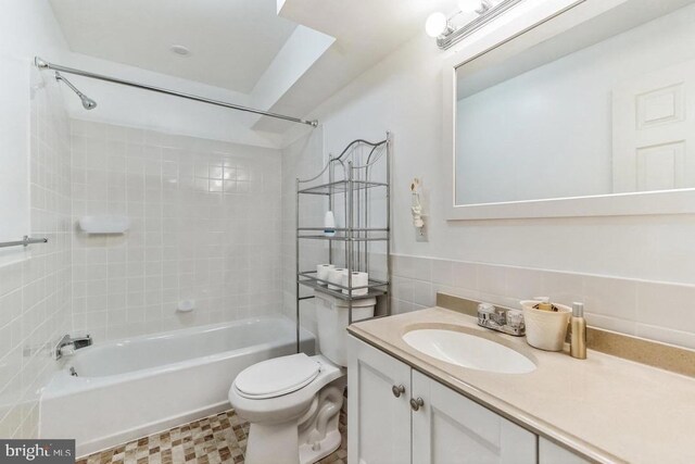 18776 Pier Trail Dr, Triangle, VA 22172 - full bath featuring bathtub / shower combination, vanity, toilet, and tile walls