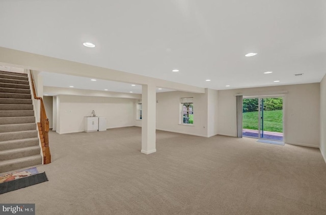 18776 Pier Trail Dr, Triangle, VA 22172 - basement featuring light carpet, recessed lighting, stairs, and baseboards