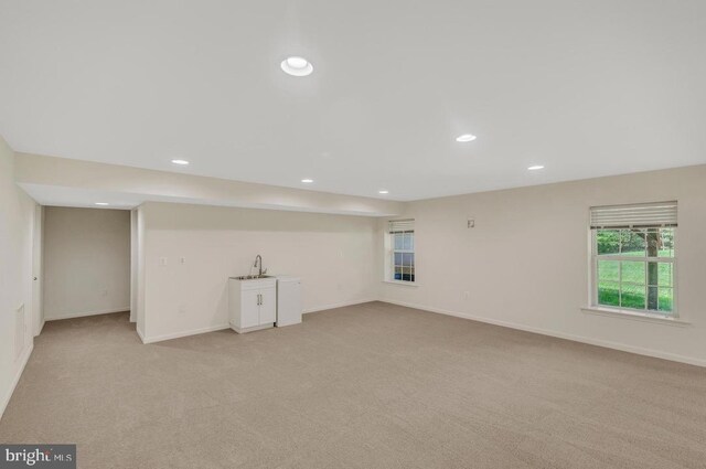 18776 Pier Trail Dr, Triangle, VA 22172 - basement featuring light carpet, healthy amount of natural light, recessed lighting, and a sink