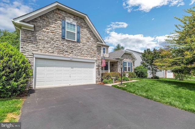 18776 Pier Trail Dr, Triangle, VA 22172 - traditional-style home with stone siding, driveway, an attached garage, and a front lawn
