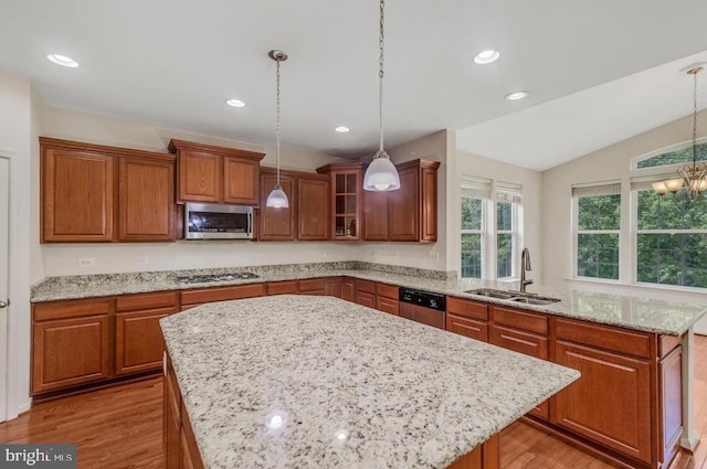 18776 Pier Trail Dr, Triangle, VA 22172 - kitchen featuring a sink, stainless steel appliances, a peninsula, brown cabinetry, and light wood-style flooring