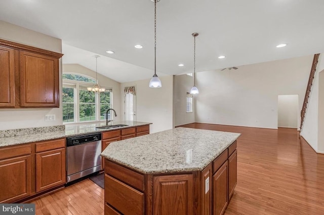 18776 Pier Trail Dr, Triangle, VA 22172 - kitchen with dishwasher, a sink, brown cabinets, a kitchen island, and lofted ceiling