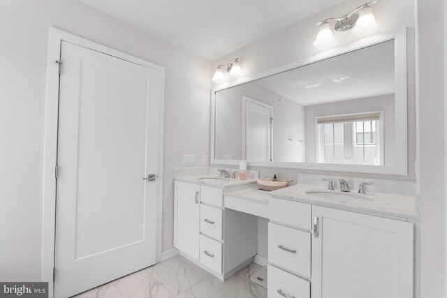 65 Tamarack Cir, Eagleville, PA 19403 - bathroom featuring double vanity and marble look tile flooring
