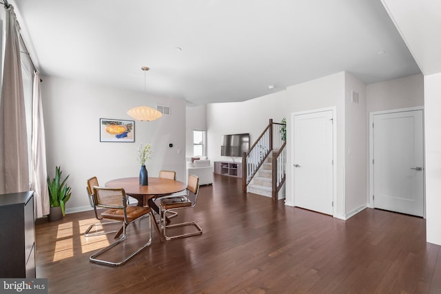 65 Tamarack Cir, Eagleville, PA 19403 - dining room featuring dark wood-type flooring, stairs, and baseboards
