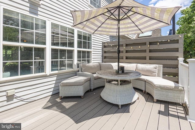 wooden terrace featuring an outdoor hangout area
