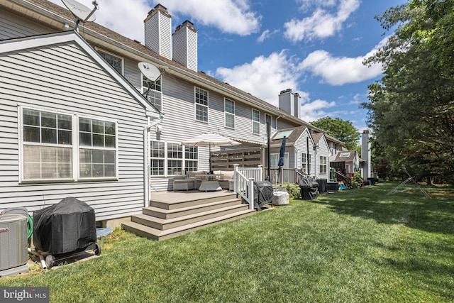 back of property with central AC unit, an outdoor hangout area, a yard, a deck, and a chimney