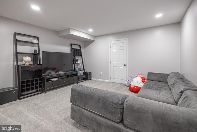 living area featuring carpet flooring, recessed lighting, and baseboards