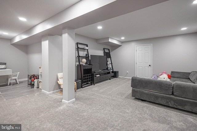 carpeted living room featuring baseboards and recessed lighting
