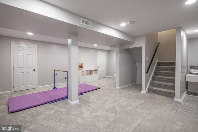 exercise room featuring carpet flooring, baseboards, and recessed lighting